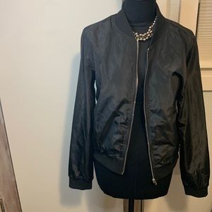 Black bomber style jacket silver zipper worn a couple times..nwot size Large